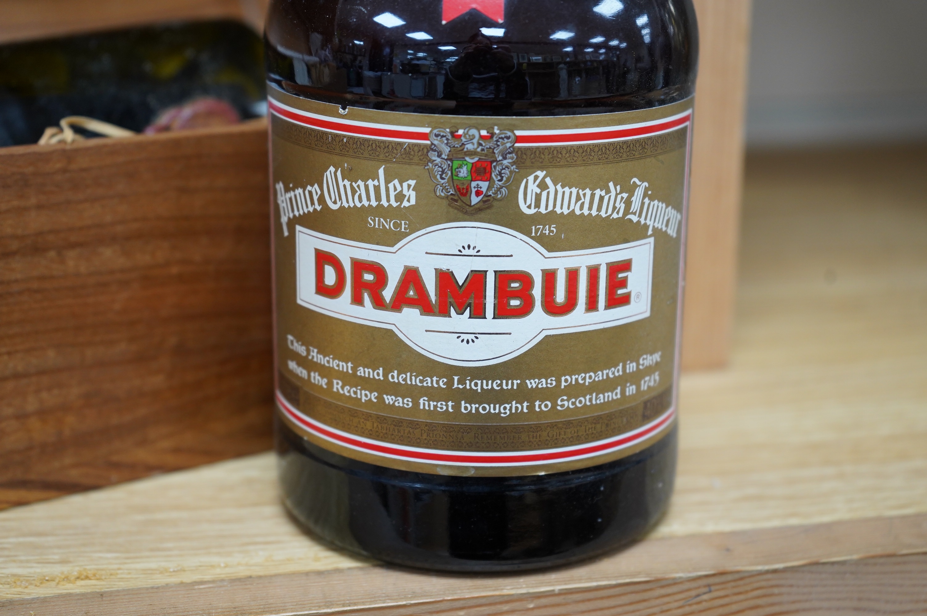 A cased bottle of Guy Lheraud ‘Tres Vieux’ Cognac, 1950 with certificate, together with a bottle of Drambuie. Condition - fair externally